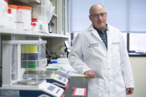 UVA researcher Steven Zeichner, MD, standing in his lab