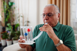 patient blows into spirometer