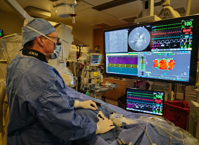 Mike Mangrum, an heart specialist and electrophysiologist, looking at a screen during an ablation procedure.