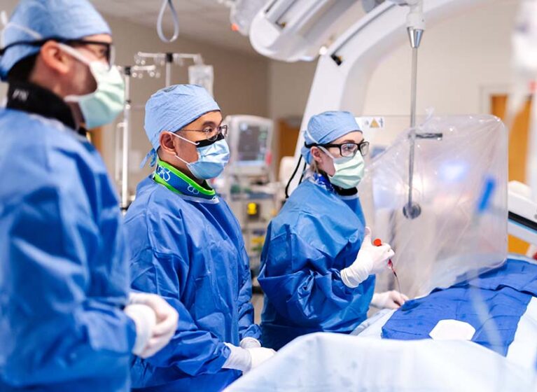 A team performs neurosurgery