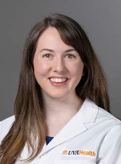 Melanie Morse in a white coat smiling for headshot
